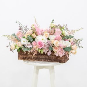 Wooden box with pink flowers