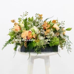loose natural flower design in a wooden box