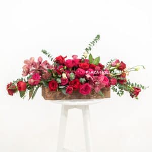 Loose flower arrangement in a wooden box