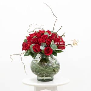 Mixed flower bouquet of red roses and eucalyptus