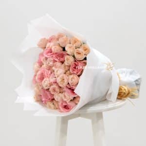 Pink mixed flower bouquet with paper