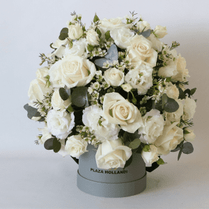 white roses, eustoma and eucalyptus arranged in a Plaza hollandi hat box