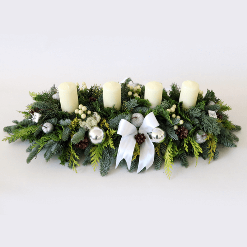 long and low white and green christmas arrangement
