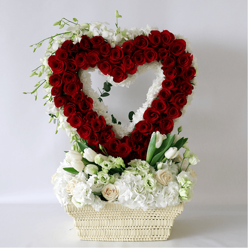red rose heart with white hydrangea, white tulips in a basket