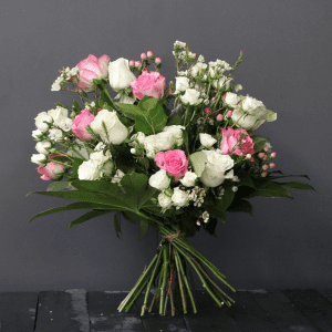 pink and white bouquet with roses, spray roses and wax flower