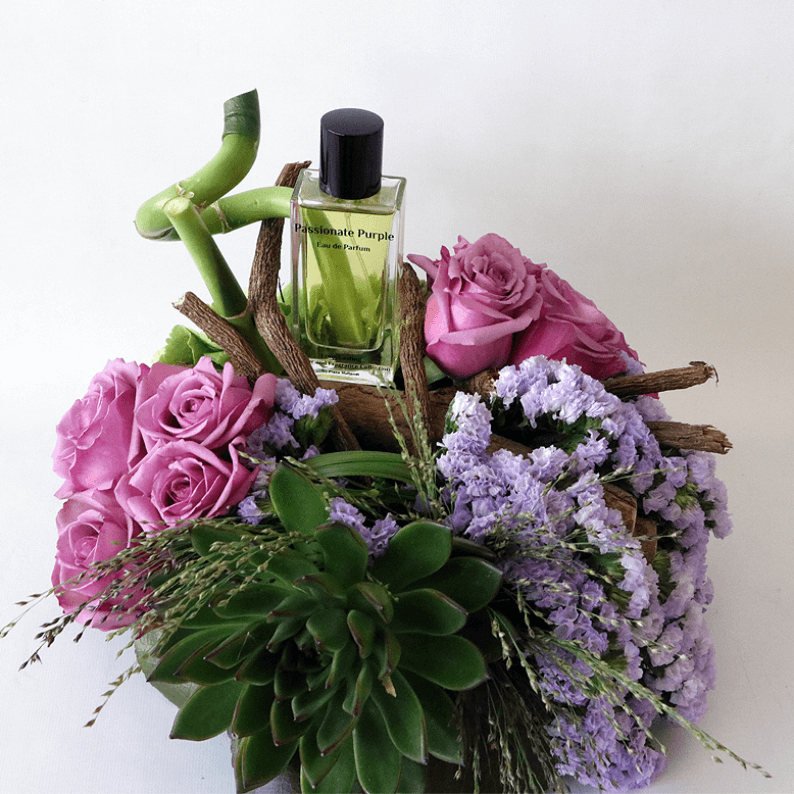 Passionate purple perfume with purple roses and succulents