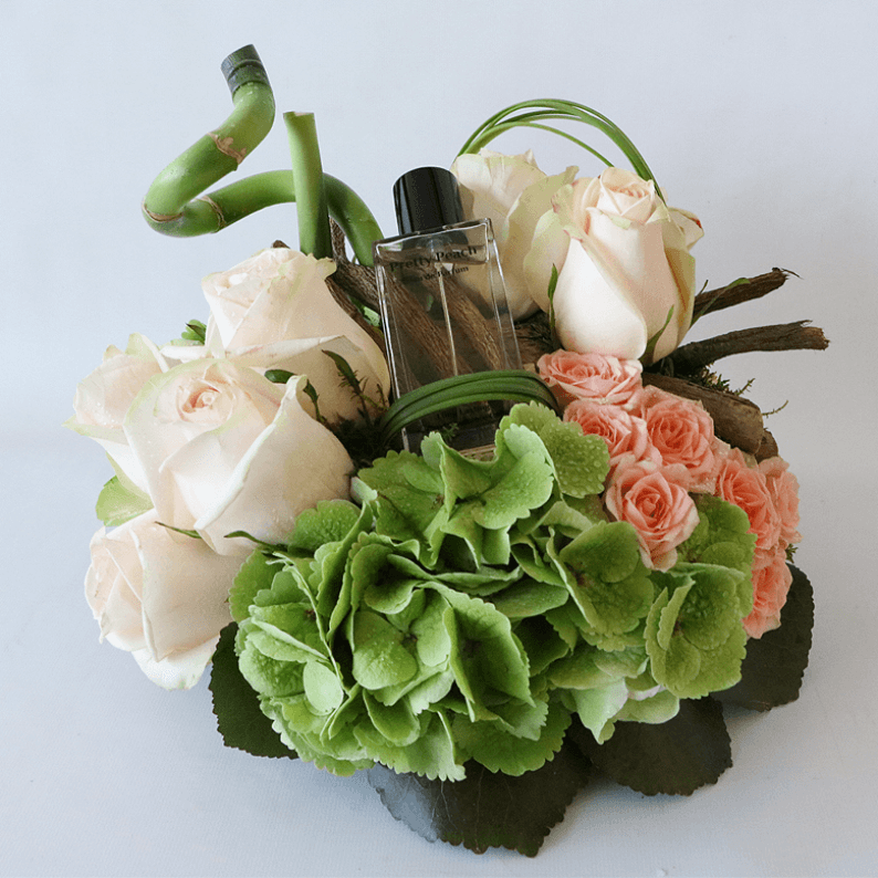 Pretty peach perfume with green hydrangea and peach roses
