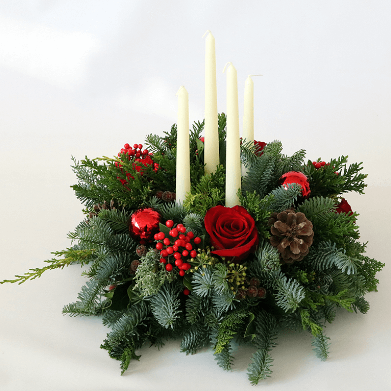 wreath arrangement with 4 long white candles