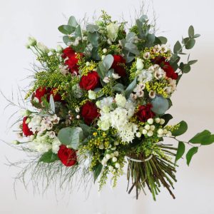 red, white and yellow bouquet with roses, eustoma, wax flower, hypericum