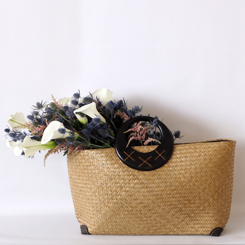 calla lily, eryngium and astilbe in a basket