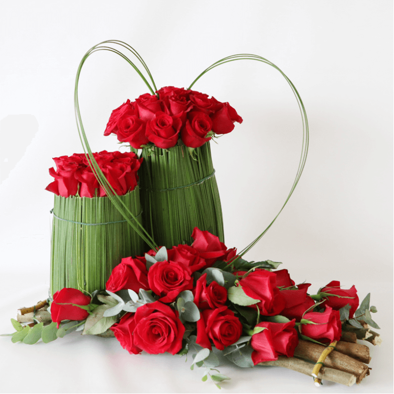 red rose and steal grass structural flower arrangement