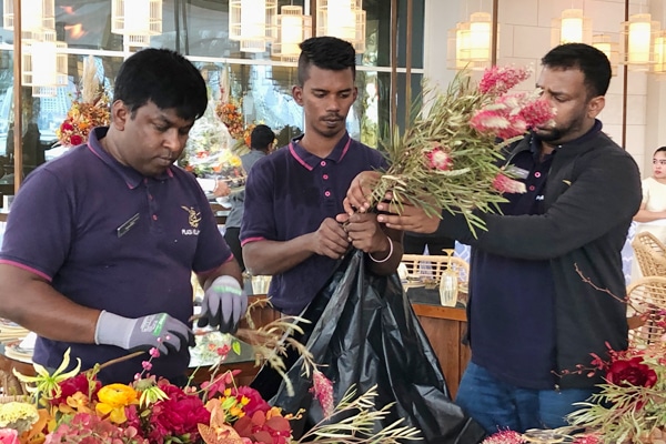 3 florists working at an event