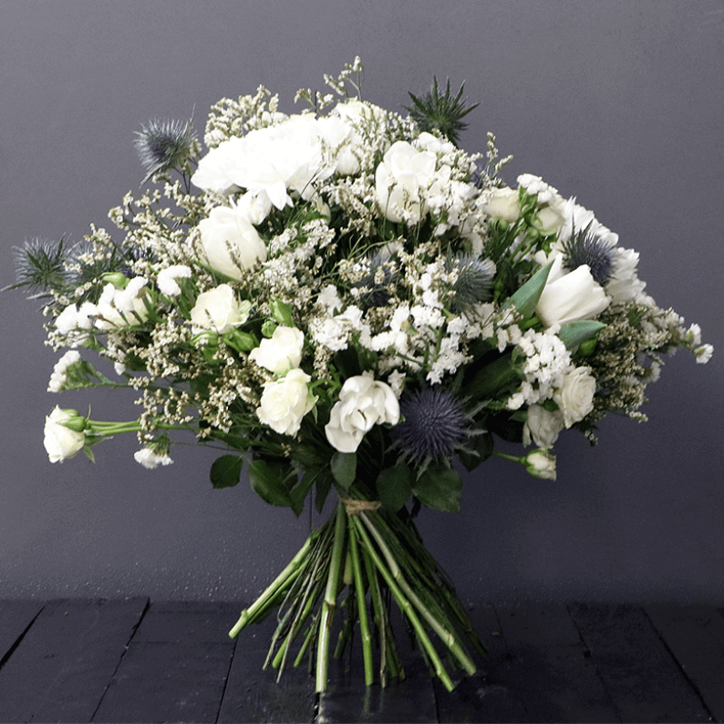 white spray rose, limonium, eryngium and eucalyptus bouquet