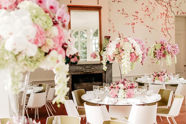 Tall wedding flower arrangements with phalaenopsis and low designs