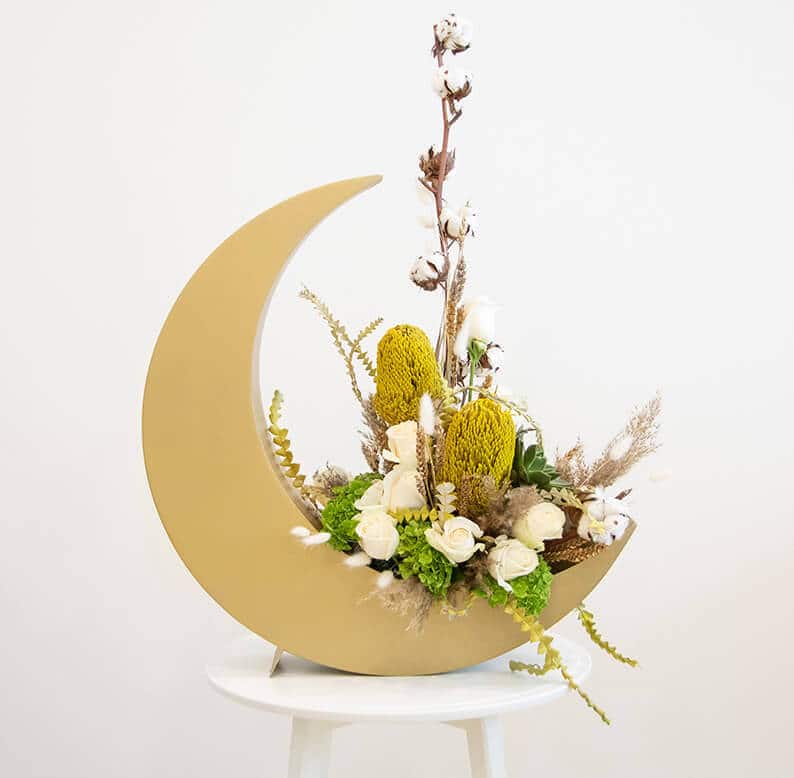 Crescent moon for Eid and Ramadan with roses and dried flowers