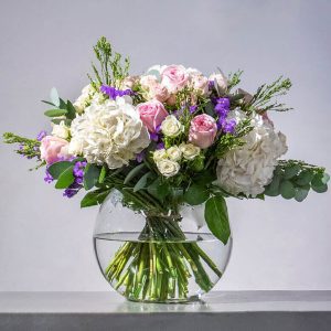 Pink, purple and white bouquet in a vase
