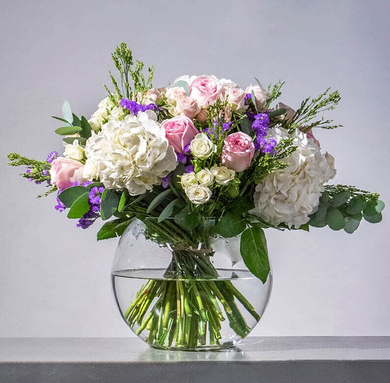 Pink, purple and white bouquet in a vase