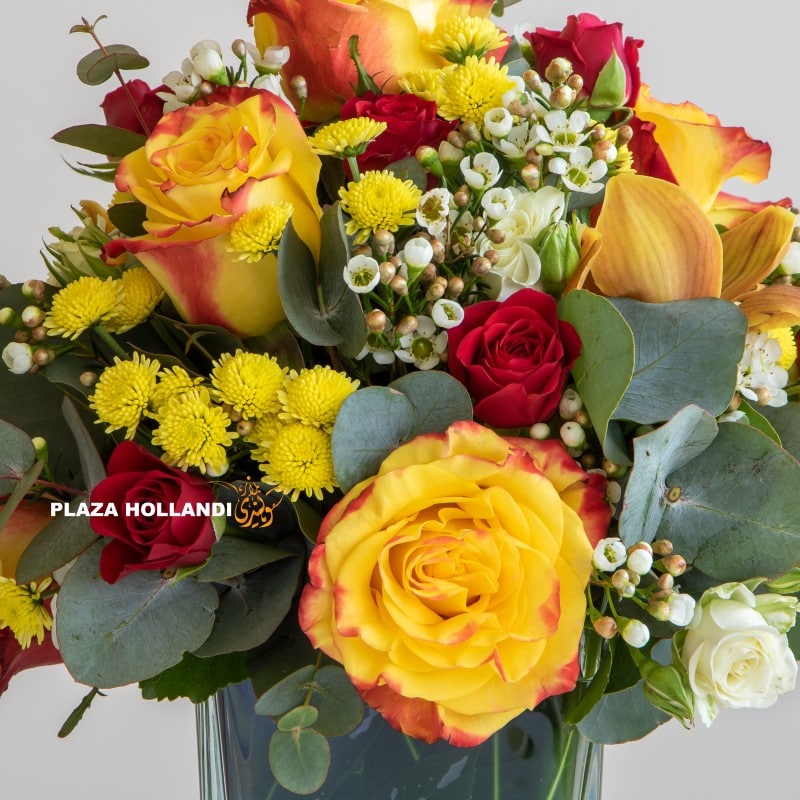 close up of yellow and red flower arrangement