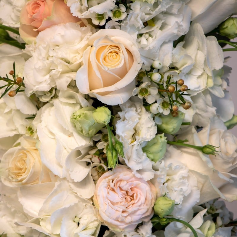 close up of hydrangea, eustoma, roses and wax flower