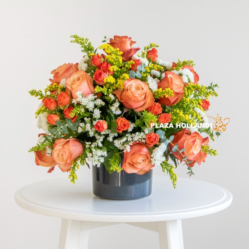 Plaza Hollandi Orange, yellow and white flower arrangement