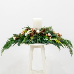 Christmas table arrangement with a large candle