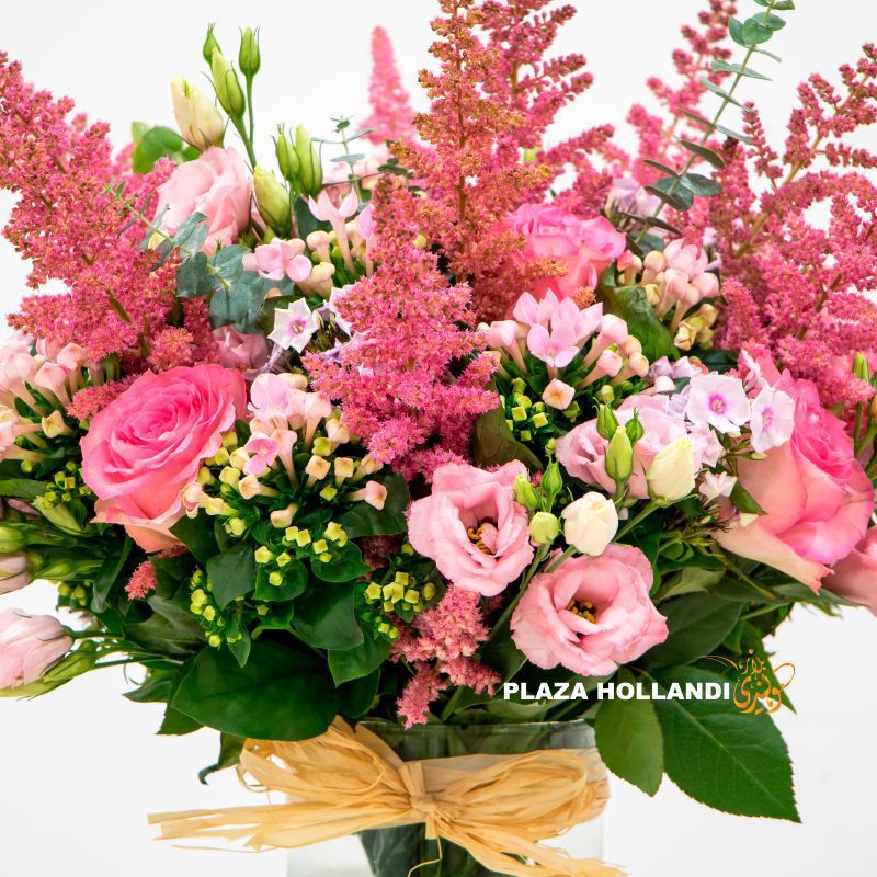 beautiful bouquet full of pink flowers in a glass vase.