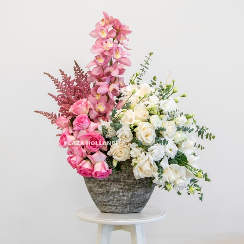 Pink and white flower arrangement in a pot