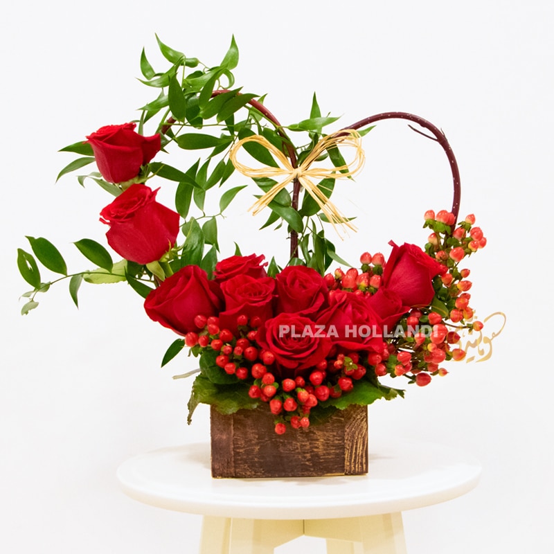 valentine red roses in a brown box hypericum