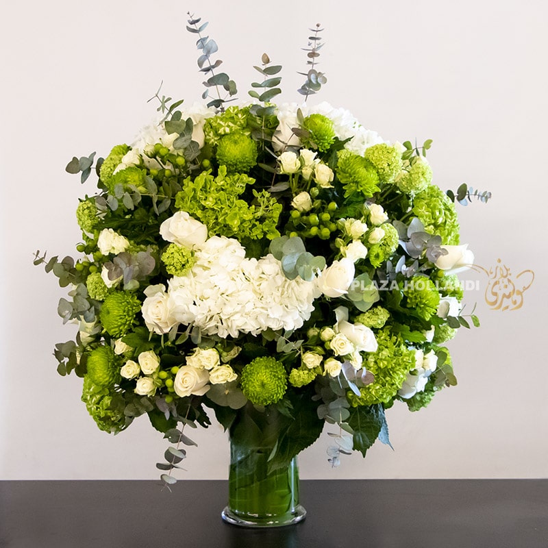 large green adn white round flower arrangement