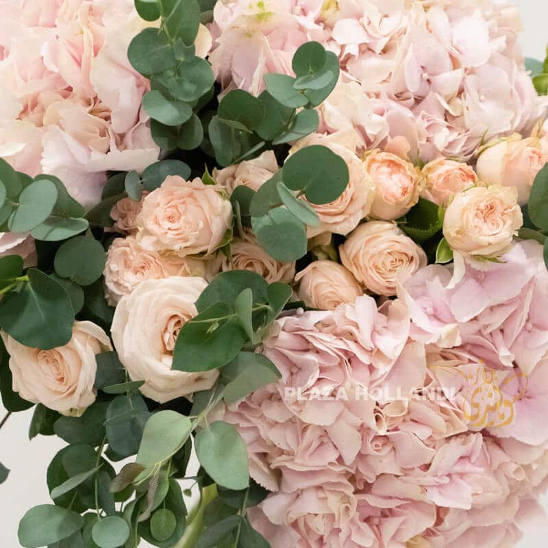 pink hydrangea, roses and spray roses in a bouquet