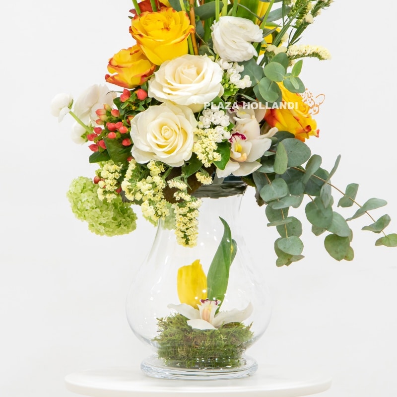 close up of yellow, white and green flower arrangement
