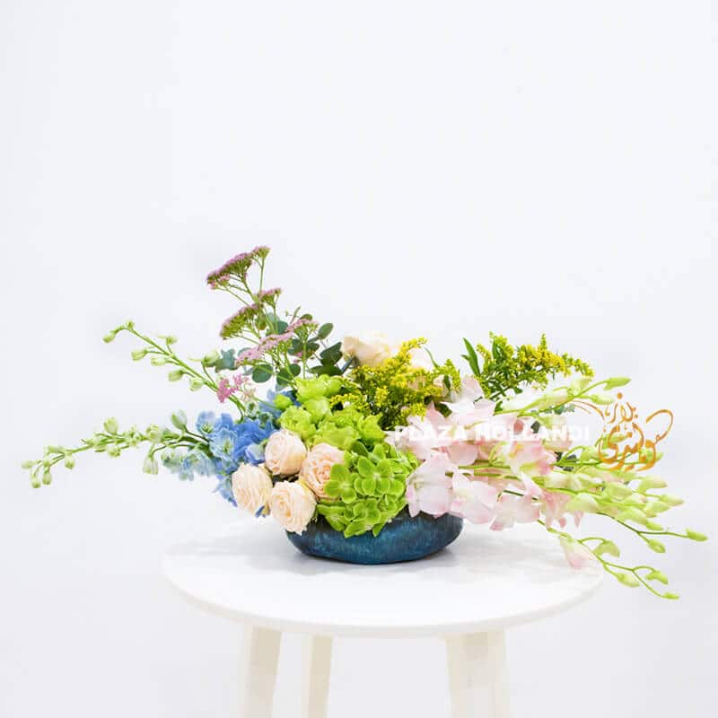 European style flower arrangement with pink and blue flowers