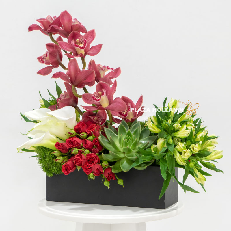 Black box filled with orchids, eustoma, spray rose and calla lily flowers