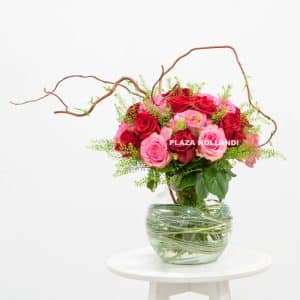 Mixed red & pink flower bouquet in a vase