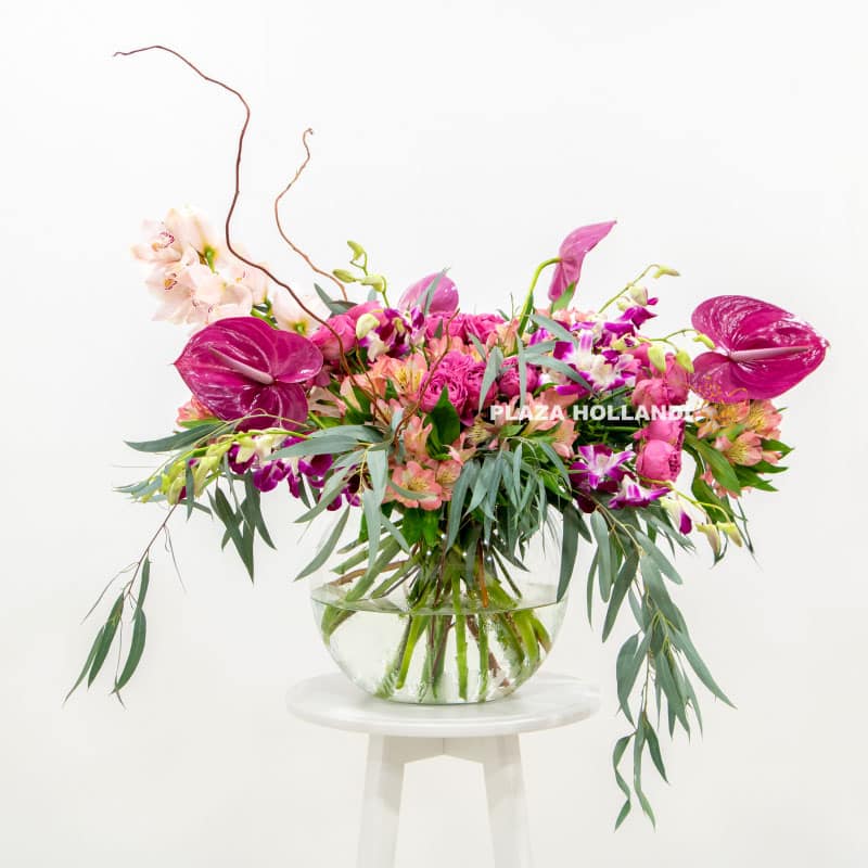 Loose purple flower arrangement in a vase