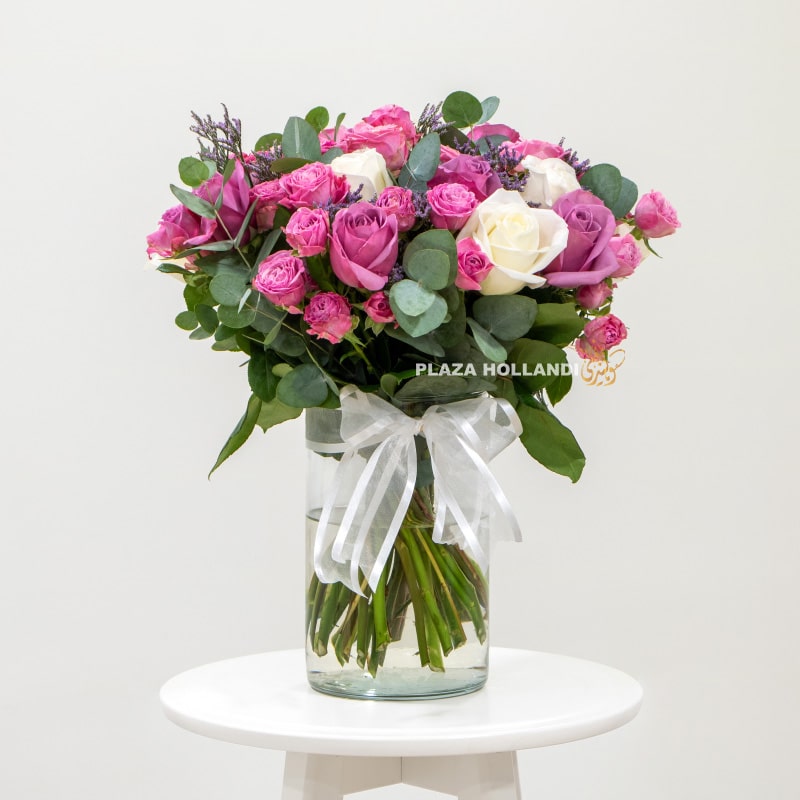 Bouquet of purple and white flowers in a vase