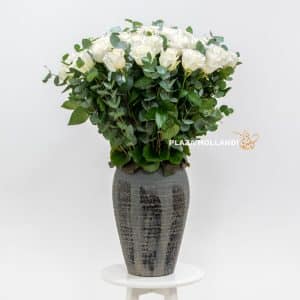 Luxurious pot with white roses and eucalyptus