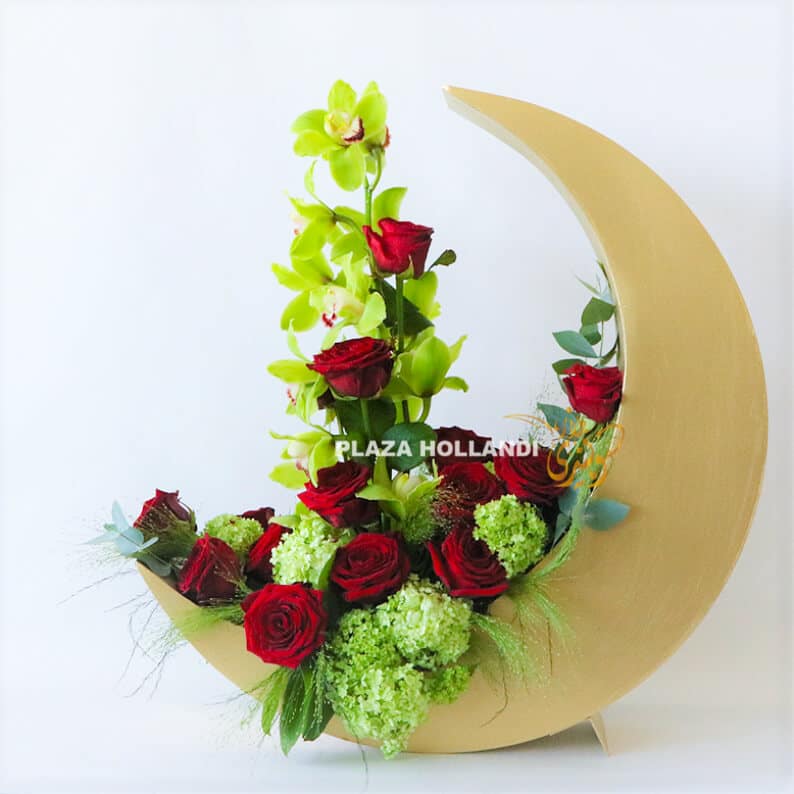 Gold crescent moon with red and green flowers