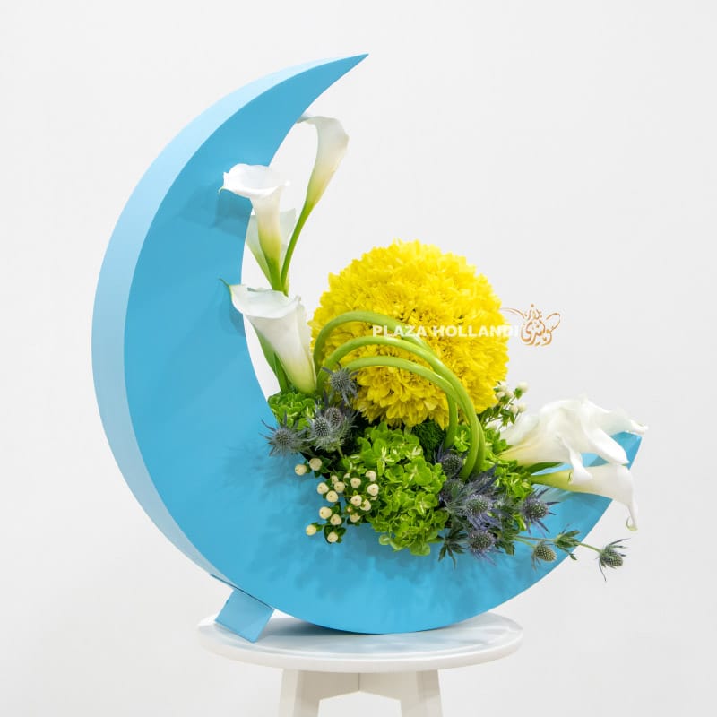 Blue crescent moon with yellow and white flowers
