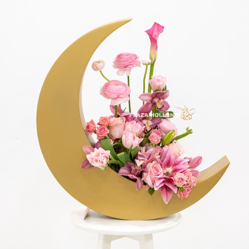 Pink flowers in a gold crescent moon