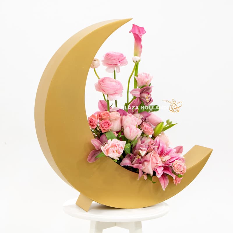 Pink flowers in a gold crescent moon