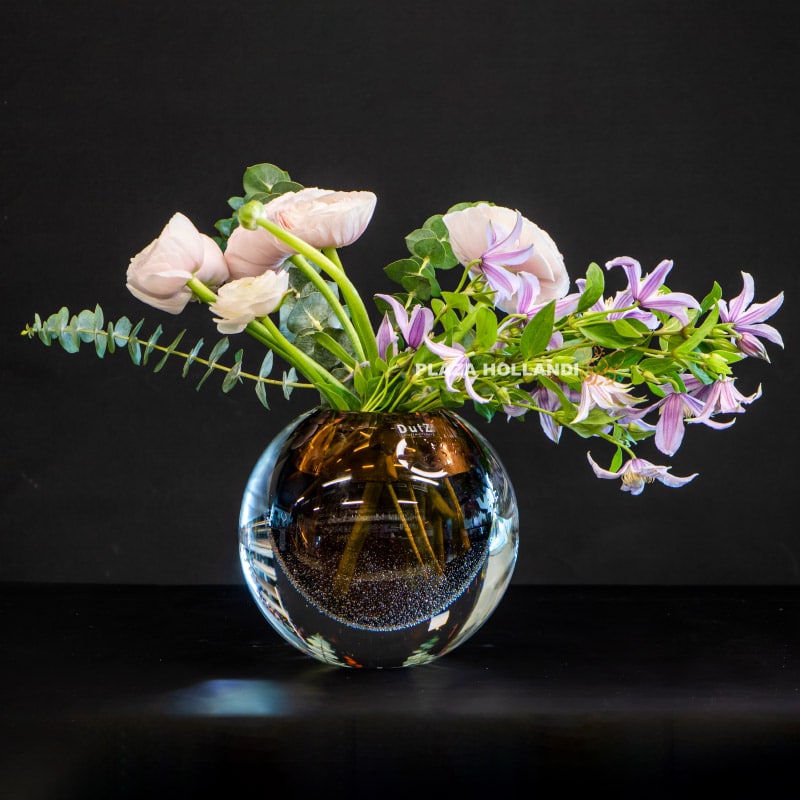 Dutz crystal vase with ranunculus and clematis