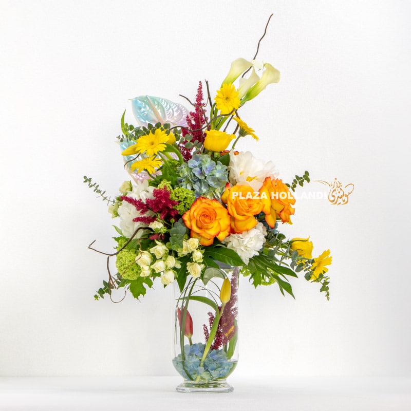loose flower arrangement in a glass vase