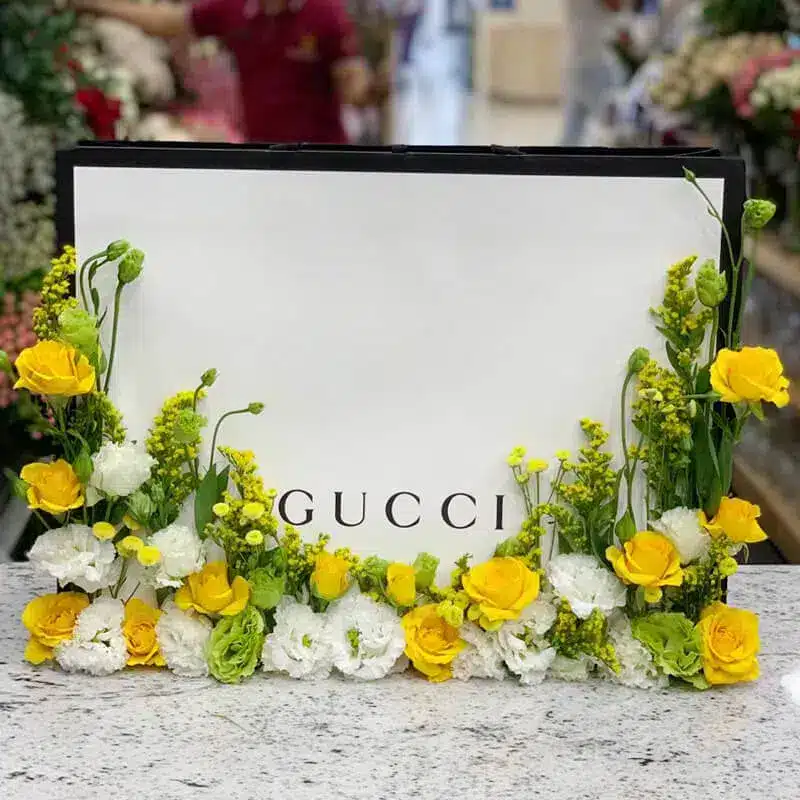 Gucci bag with yellow roses and white eustoma
