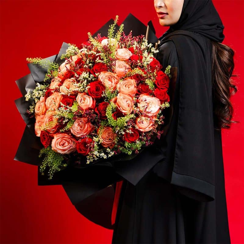 Elegant Blend: Orange & Red Roses with White and Purple Limonium