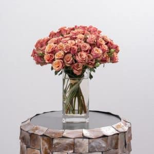 Delicate Pink Spray Roses Display in Glass Vase