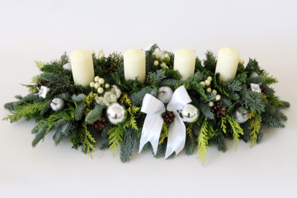 long and low white and green christmas arrangement